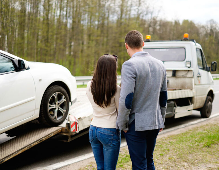 Vehicle collection truck loading a non-running car